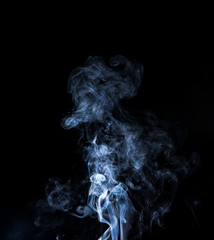 jet of gray smoke on a black background
