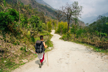 Hiking in Himalaya. Woman Traveler in the Mountains