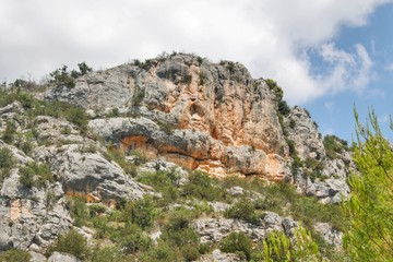 Naklejka premium Faces inside stony mountain