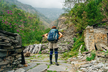 Hiking in Himalaya. Woman Traveler in the Mountains