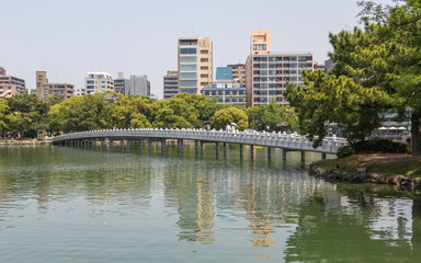 Fototapeta na wymiar Ohori Park pond with bow brigde, Island and background. Chuo-ku, Fukuoka, Japan, Asia.