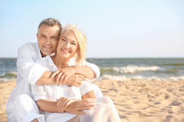 Happy mature couple at sea resort