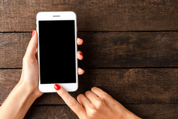 Woman using smartphone. Top view