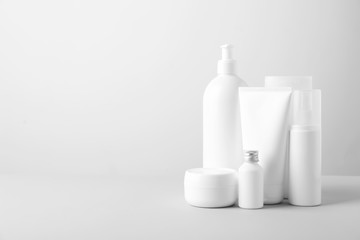 Set of cosmetic products on light background