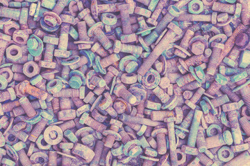Abstract grunge metal background from old rusty bolts, screws, nuts and washers