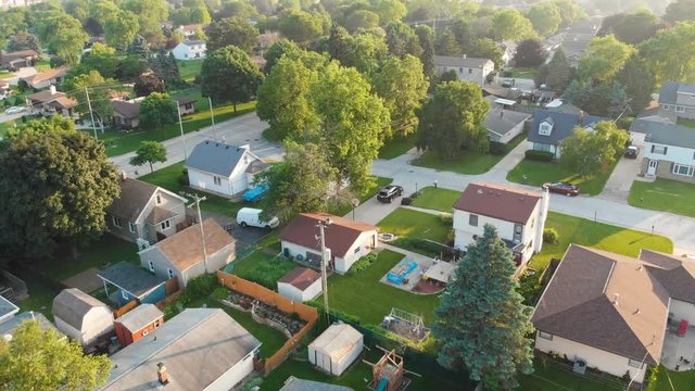 Aerial view of residential houses at summer. American neighborhood, suburb.  Real estate, drone shots, sunrise, sunlight, from above.