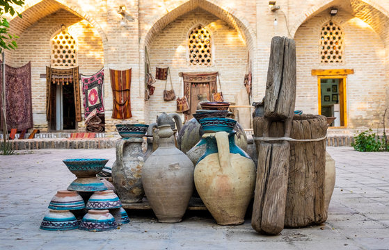 Large earthenware jugs in inner yard of old center of Bukhara, Uzbebkistan