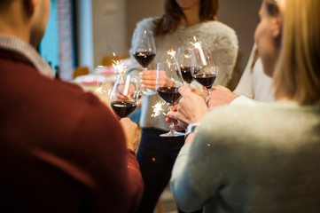 Friends celebrate their birthday at the local winery. Elegant glasses with homemade quality wine