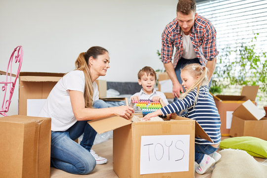 Children and parents in teamwork unpacking
