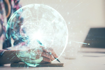 International business hologram over hands taking notes background. Concept of success. Multi exposure