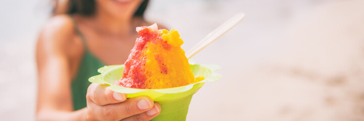 Shave Ice Hawaiian food dessert woman eating frozen treat panoramic banner background.