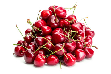 Obraz na płótnie Canvas heap of red cherries isolated on white background