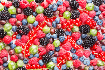 heap of fresh various berries as textured background