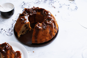 Festive bundt cake with dates and salted caramel. Sticky toffee pudding style. Copy space