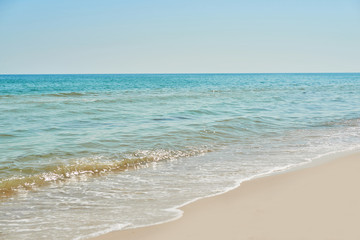View of beach and sea, blue water. Tourism and vacation on ocean. Family vacation in summer. Vacation at sea . Summer travel.