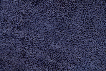 Navy blue background from a soft upholstery textile material, closeup.