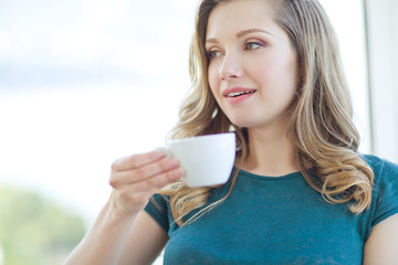 Woman drinking coffee. 