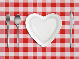 Heart shaped plate, fork, spoon and knife on checkered tablecloth in red and white colors top view, empty table setting, Valentine day romantic dish, love symbol. Realistic 3d vector illustration