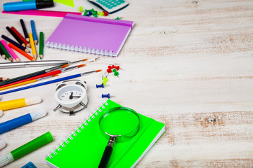 Items for the school on a wooden table.