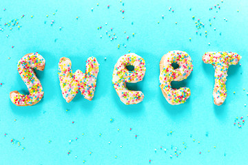 Blue background with letters icing sweet from cookie