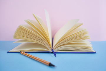  Colorful background with a notebook or books on a table and decorative objects.