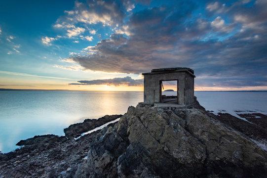 The old defences at Brean Down Fort, Brean Down, with Bristol Channel and Steep Holm Island in far distance, at sunset, Somerset