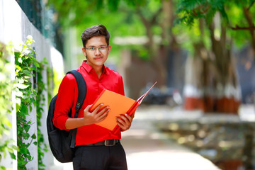 College Boy holding with file in hand 