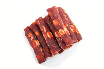 Brown traditional turkish delight (rahat lokum) with peanuts isolated on white background. top view.