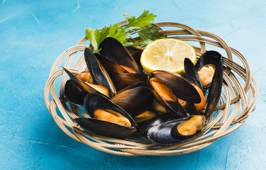 Close-up high angle view cooked mussels in basket