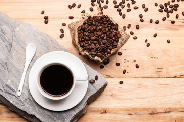 Coffee with coffee beanand on wooden table