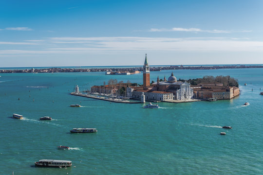 Day view of San Giorgio Maggiore Island with church at Venetian lagoon, with Lido background view, Venice, Veneto