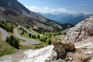 The Southern side of Izoard pass with the winding road and the dramatic landscape called Casse deserte (a lunar and rocky circus), Queyras Regional Natural Park, Southern Alps, France, Europe, hautes 