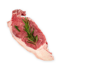 Raw steak with spice on white