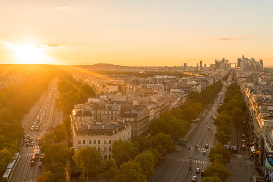 View from Arc de Triomphe at sunset, with La Defense in the distance on the right, Paris, France