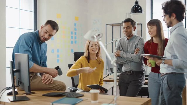 In the Modern Office: Diverse Group of Colleagues Have Meeting, Develop Strategy, Discuss Project Progress, Customer Experience Management also Have a bit Of Fun and Jokes. Smiling Businesspeople Chat