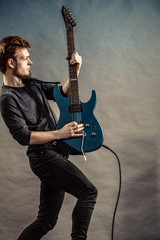 Man playing on electric guitar