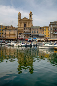 Boats moored in the port at Bastia with St. Jean Baptiste church, Bastia, Corsica, France, Mediterranean