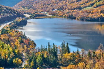 View of Echo Lake from Artist's Bluff in autumn. Fall colours in Franconia Notch State Park. White...