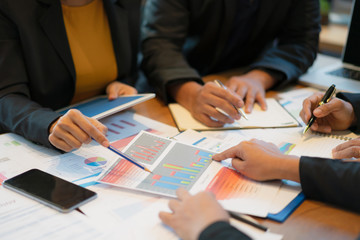 Business team meeting to discuss and summarize statistical data, balance sheet, company expenditure.