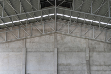 Cement walls and roof structures of warehouses.