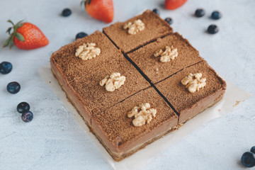 Vegan sweet potato brownie on white table. Healthy vegan food concept.