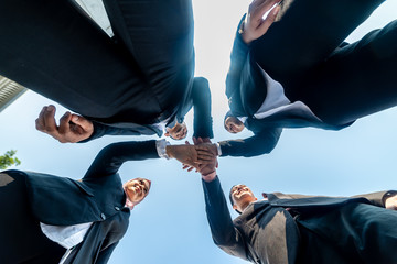 Fototapeta premium Muslim Business People join hands together. Team Teamwork Togetherness Collaboration Concept.
