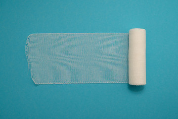 Fototapeta premium medical bandage isolated on blue background