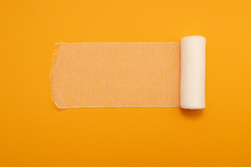 medical bandage isolated on yellow background
