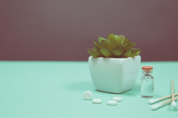 Assorted medical drugs and syringe on blue background