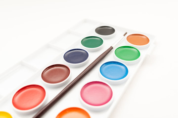 Top view of watercolor paint in box on white background