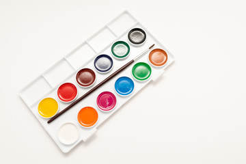 Top view of watercolor paint in box on white background