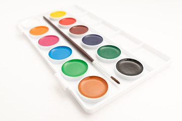 Top view of watercolor paint in box on white background