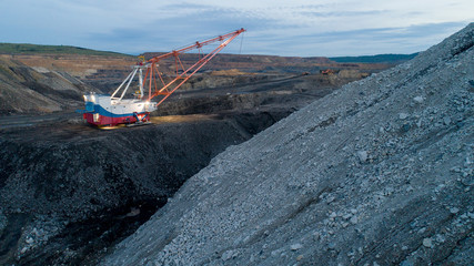 excavator open pit coal mining night lights