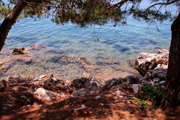 Sea coast and beach with rocks, rocky coastline, blue sea, good sunny day. Summer trip. Beautiful Greece. Most beautiful beach, natural environment, waves and tropical landscape, horizon and panorama.